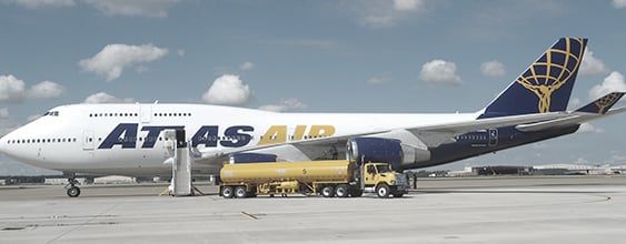 Atlas Air jet being refueled by fuel truck as it sits on the tarmac